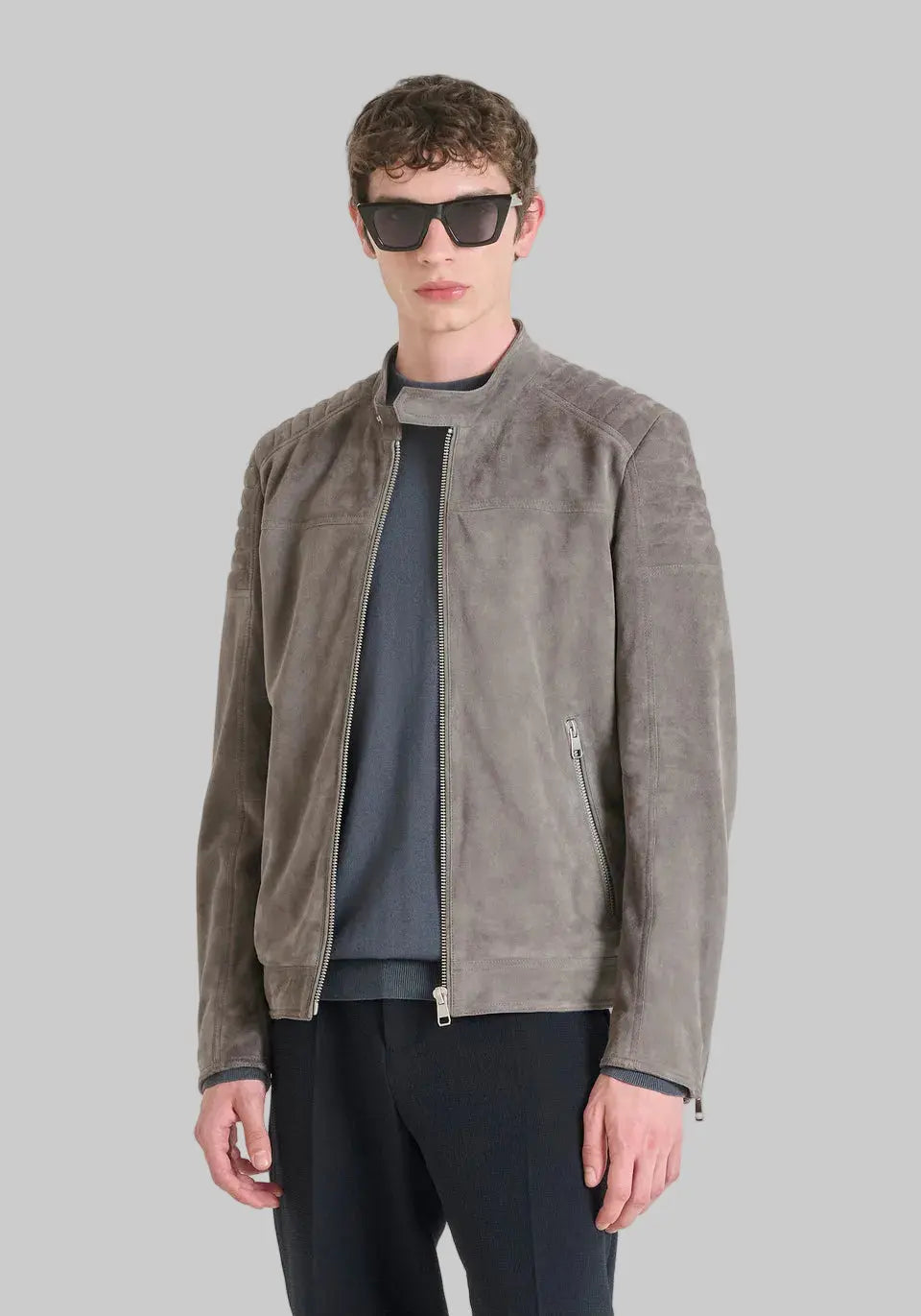 Men's slim fit suede jacket in stone grey featuring premium suede leather, biker-inspired detailing, zip-front closure and modern tailored fit.