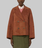Women's Signature Suede Pea Coat in premium brown suede featuring a double-breasted design, wide lapels, relaxed fit, and elegant contemporary styling